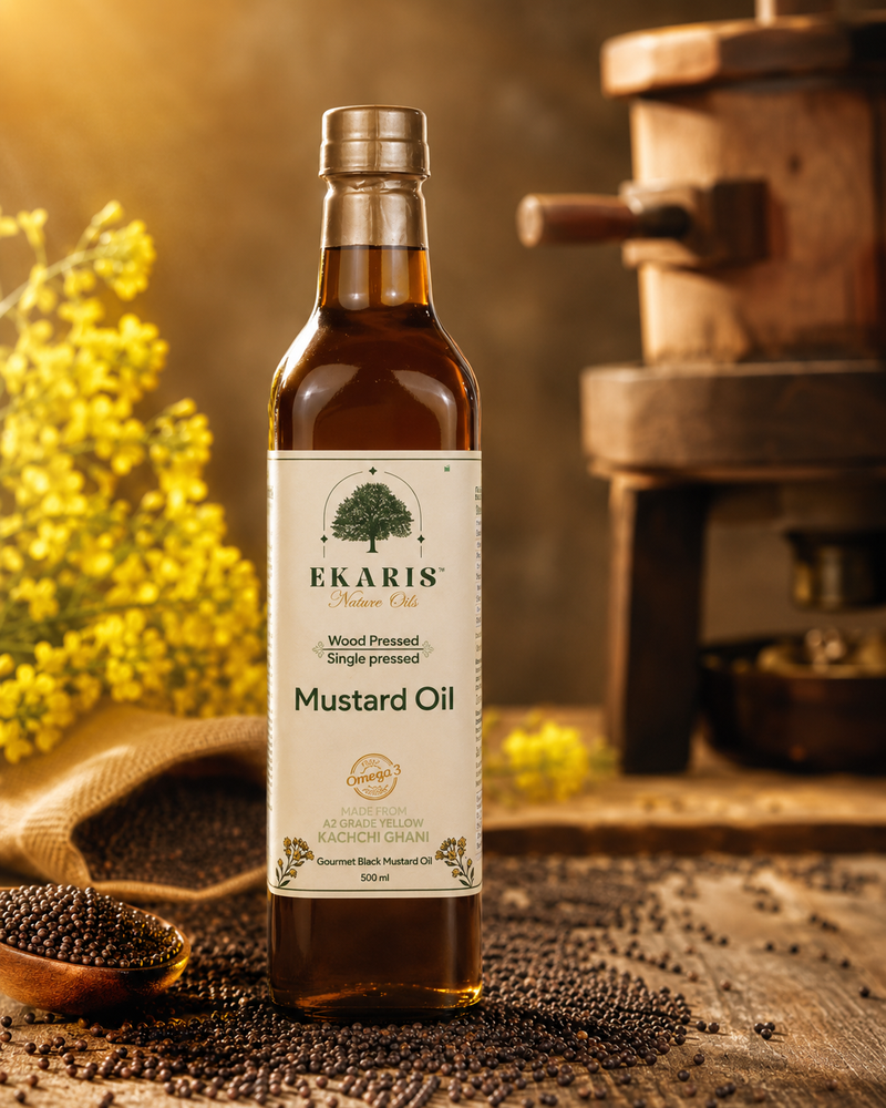 Cold Pressed Mustard Oil Price - Ekaris Wood Pressed Mustard Oil in amber glass bottle with traditional wooden ghani and mustard seeds