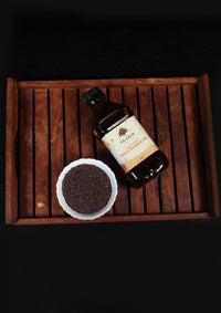Best Cold Pressed Black Mustard Oil in India - Ekaris with Black Mustard Seeds on Wooden Tray