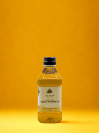 Ekaris Cold-Pressed Yellow Mustard Oil bottle on vibrant yellow studio background