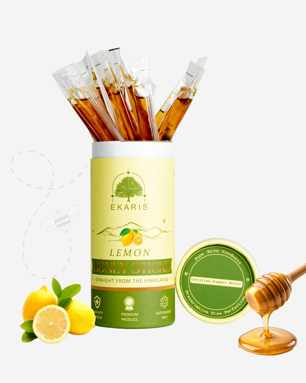 Ekaris Organic Honey Lemon Flavored Sticks tube with honey dipper and fresh lemons