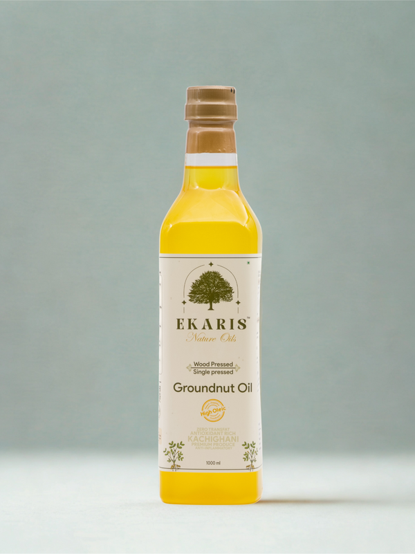 Ekaris Wood Pressed Single Pressed Groundnut Oil Kachchi Ghani 1 litre glass bottle on grey background